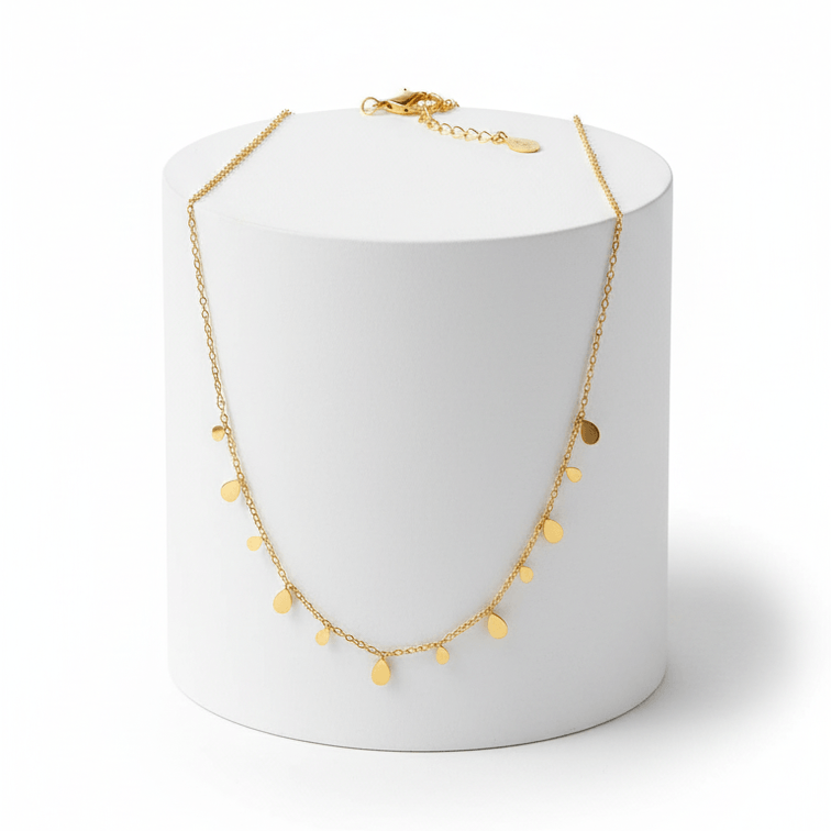 Mini Teardrop Charm Necklace on round pedestal