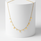 Mini Teardrop Charm Necklace on pedestal