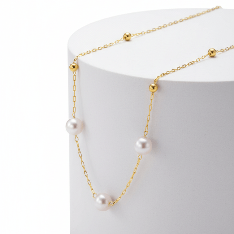 Minimal Pearl Station Necklace on round pedestal