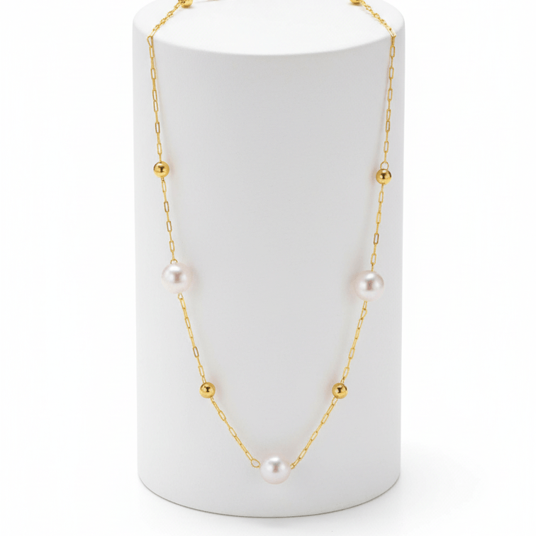 Minimal Pearl Station Necklace on round pedestal white