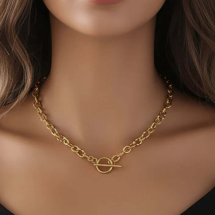 Ceyrah gold chain necklace with toggle clasp on woman’s neck, elegant jewelry