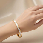 Ceyrah Pearl Inlay Bangle Gold Bracelet on wrist, elegant jewellry on neutral background