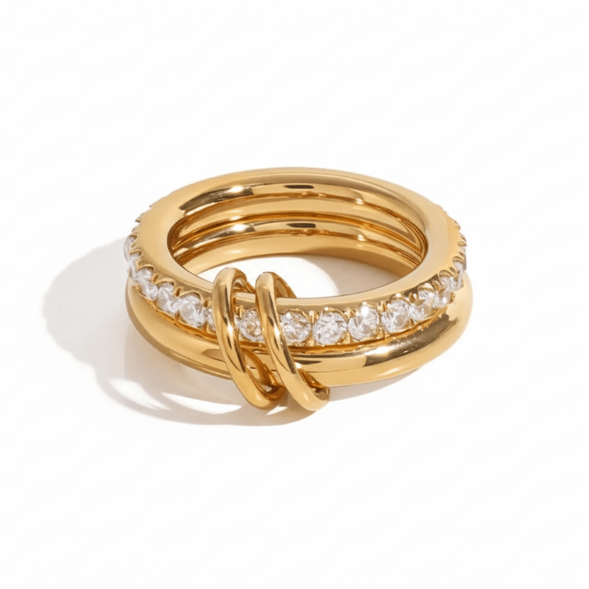 Double Layered Gold Gemstone Ring with polished gold band and embedded clear stones.