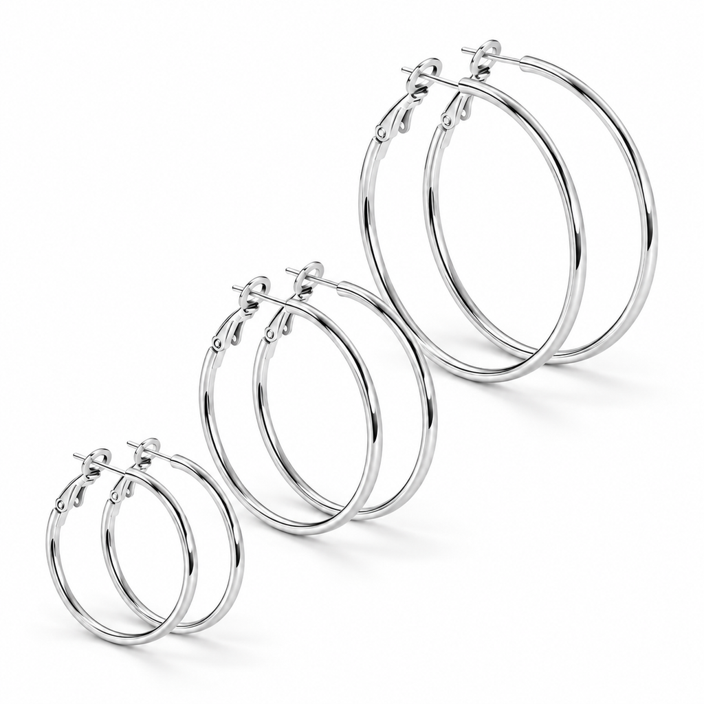 three pairs of polished silver Waterproof Trio of Classic Hoop Earrings, arranged diagonally on a clean white background.