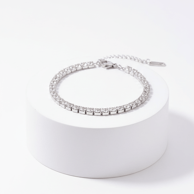 Silver Crystal Tennis Classic Bracelet on a white pedestal with a white background