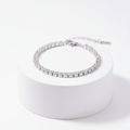 Silver Crystal Tennis Classic Bracelet on a white pedestal with a white background
