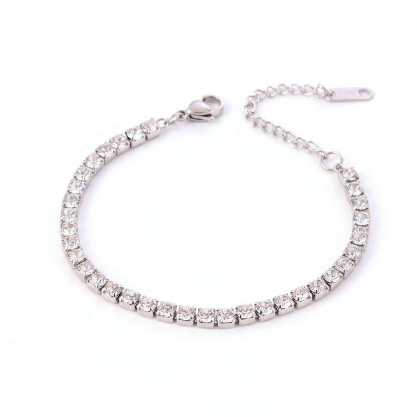 Silver Crystal Tennis Classic Bracelet with clear stones on a beige background