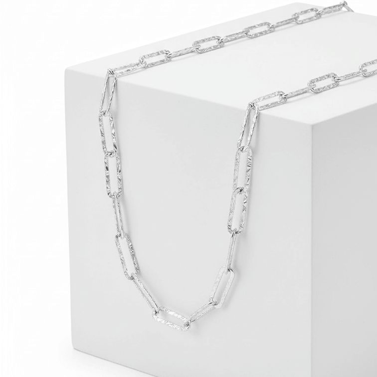 Silver Paperclip Chain Necklace on square pedestal 