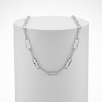 Silver Paperclip Chain Necklace on white pedestal 