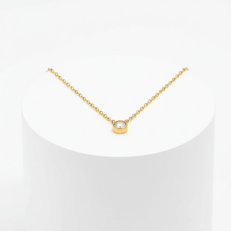 Single Diamond Necklace Gold on white pedestal