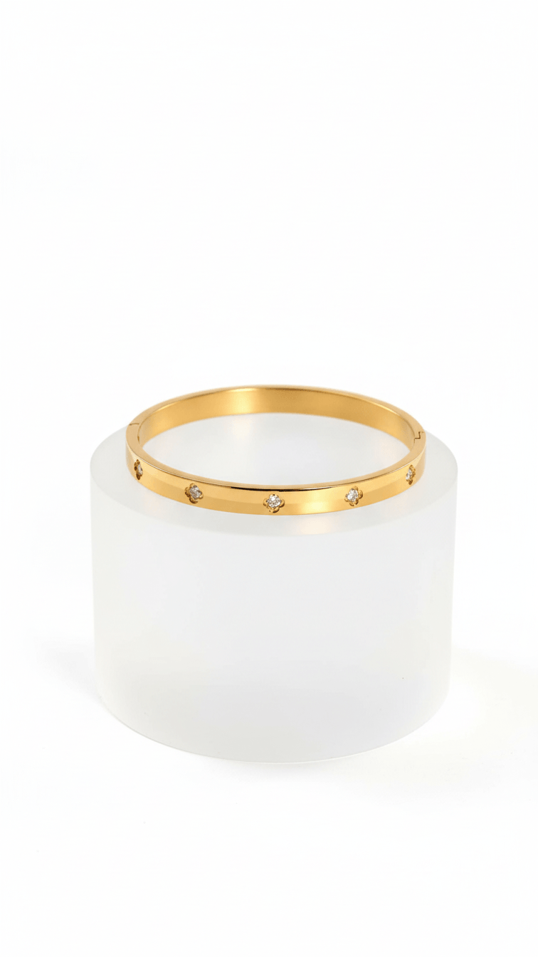 Small Clover Bangle Bracelet on white round pedestal