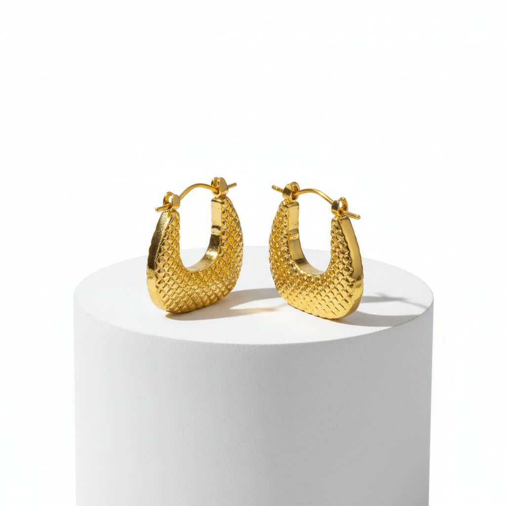 Textured Gold Crescent Hoop Earrings on stone
