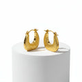 Textured Gold Crescent Hoop Earrings on stone