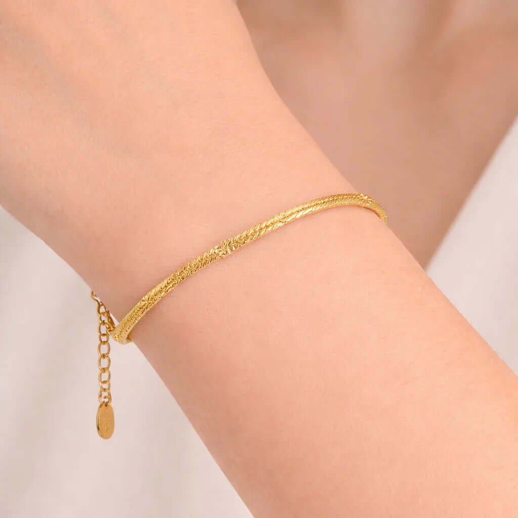Ceyrah gold Textured Snake Chain Bracelet with adjustable clasp on wrist, minimalist jewelry