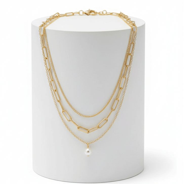 Three-layer Pearl Necklace Gold on white pedestal