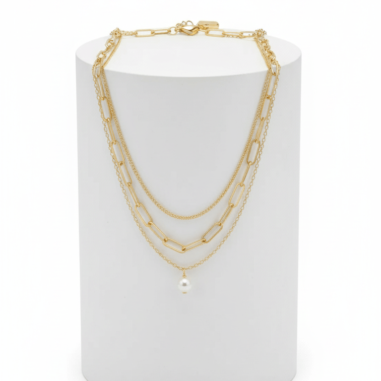 Three-layer Pearl Necklace Gold on white pedestal 