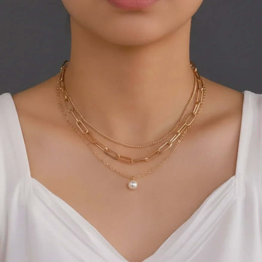 Three-layer Pearl Necklace Gold on model wearing white top from Ceyrah