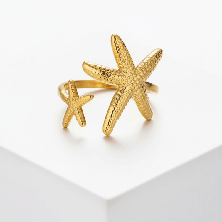 Twin Starfish Open Gold Ring on a white background