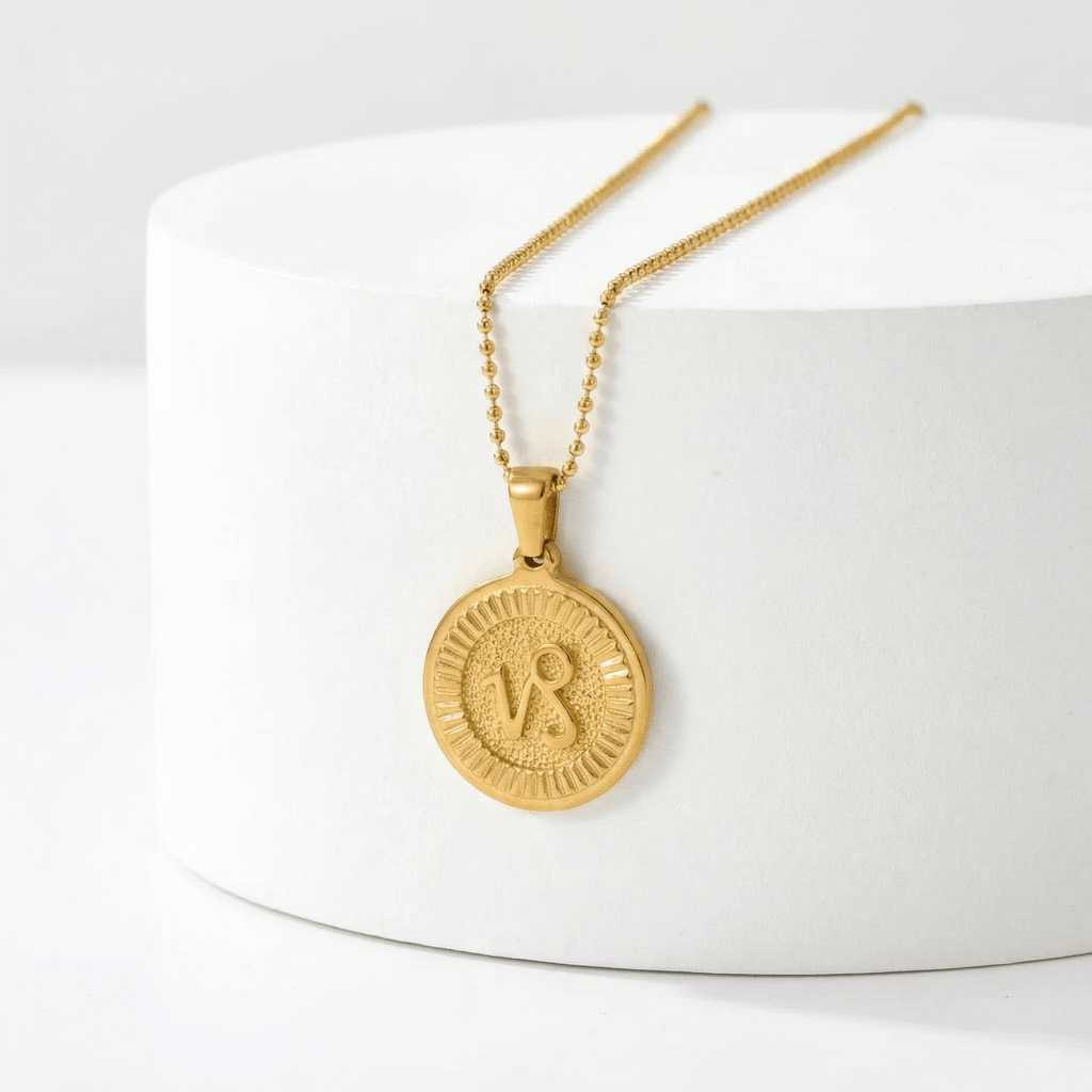 Zodiac Sign Medallion Necklace Gold on a white surface