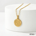 Zodiac Sign Medallion Necklace Gold with Aries zodiac sign pendant on a white surface