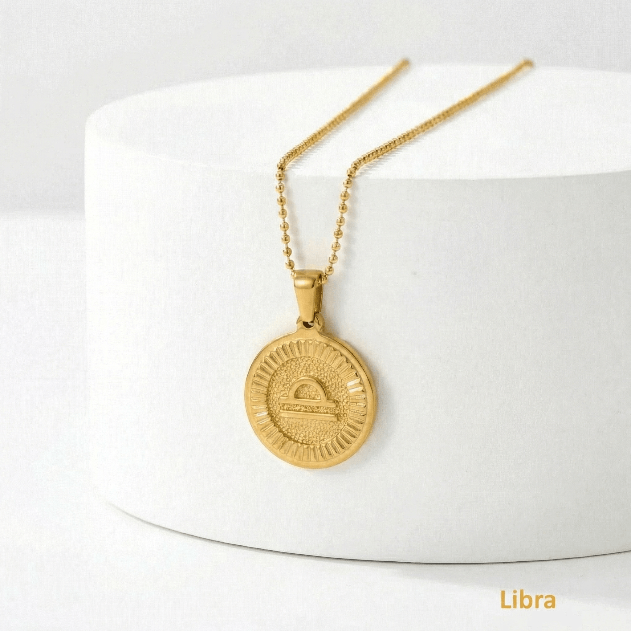 Zodiac Sign Medallion Necklace Gold with Libra pendant on a white background