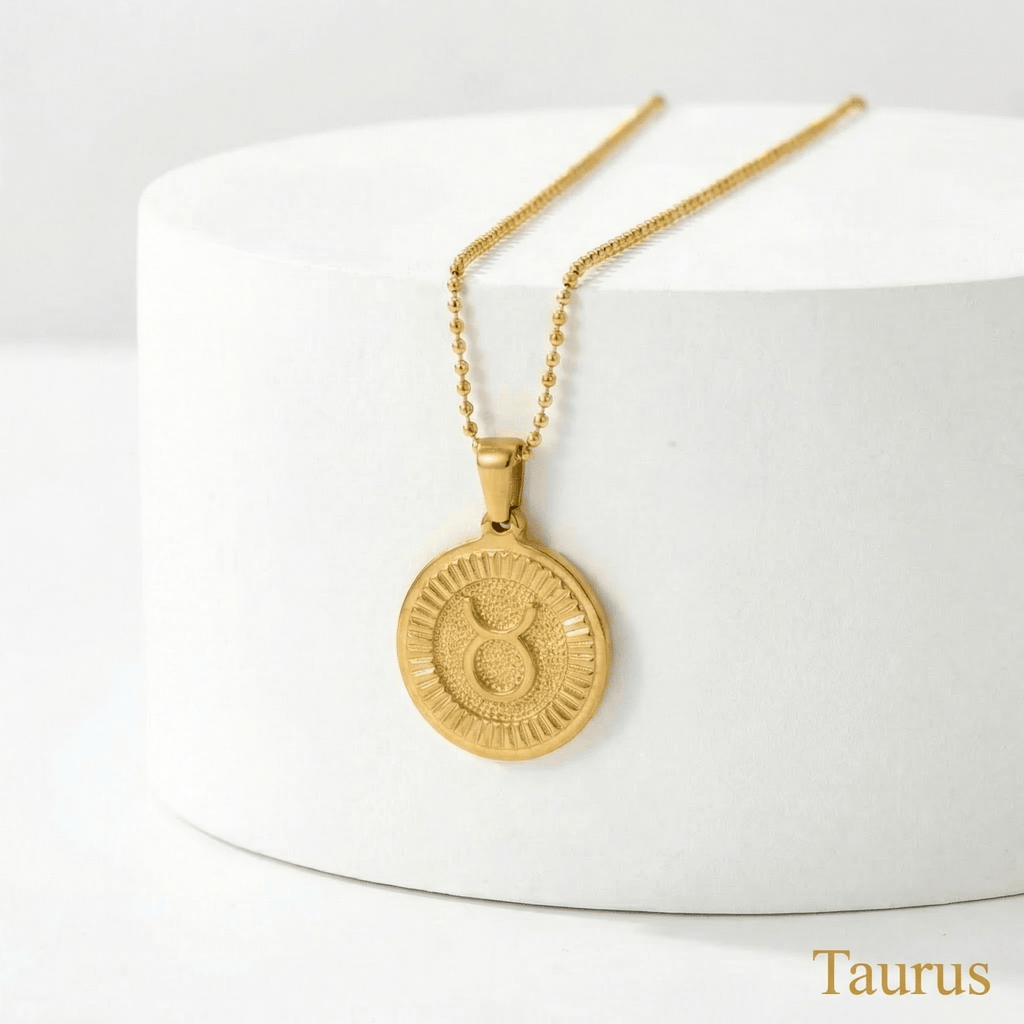 Taurus Zodiac Sign Medallion Necklace Gold on a white stand with 'Taurus' text.
