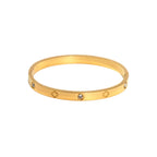 Ceyrah gold clover engraved diamond bangle bracelet on white background