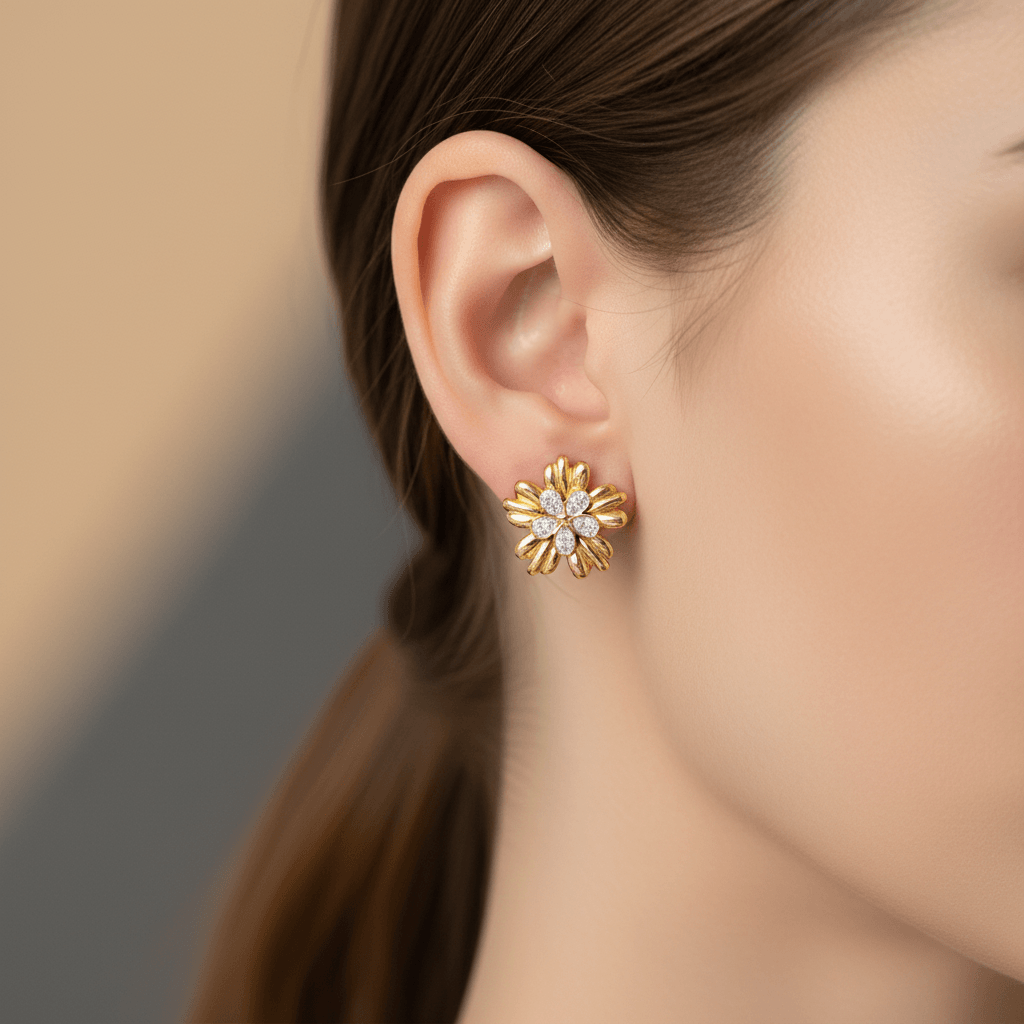 Five-Petal Gold Stud Earrings worn by a person with a blurred background