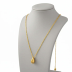 Ceyrah gold teardrop pendant necklace on display bust, elegant jewelry accessory