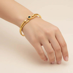 Ceyrah gold spike cuff bracelet with black accent on wrist, minimalist jewellery style