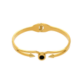 Ceyrah gold spike cuff bracelet with black accent on white background