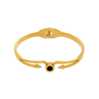 Ceyrah gold spike cuff bracelet with black accent on white background