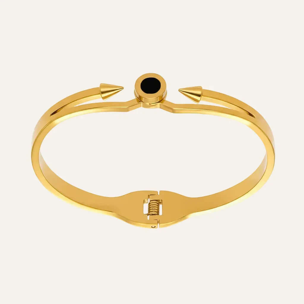 Ceyrah gold spike cuff bracelet with black accent on white background